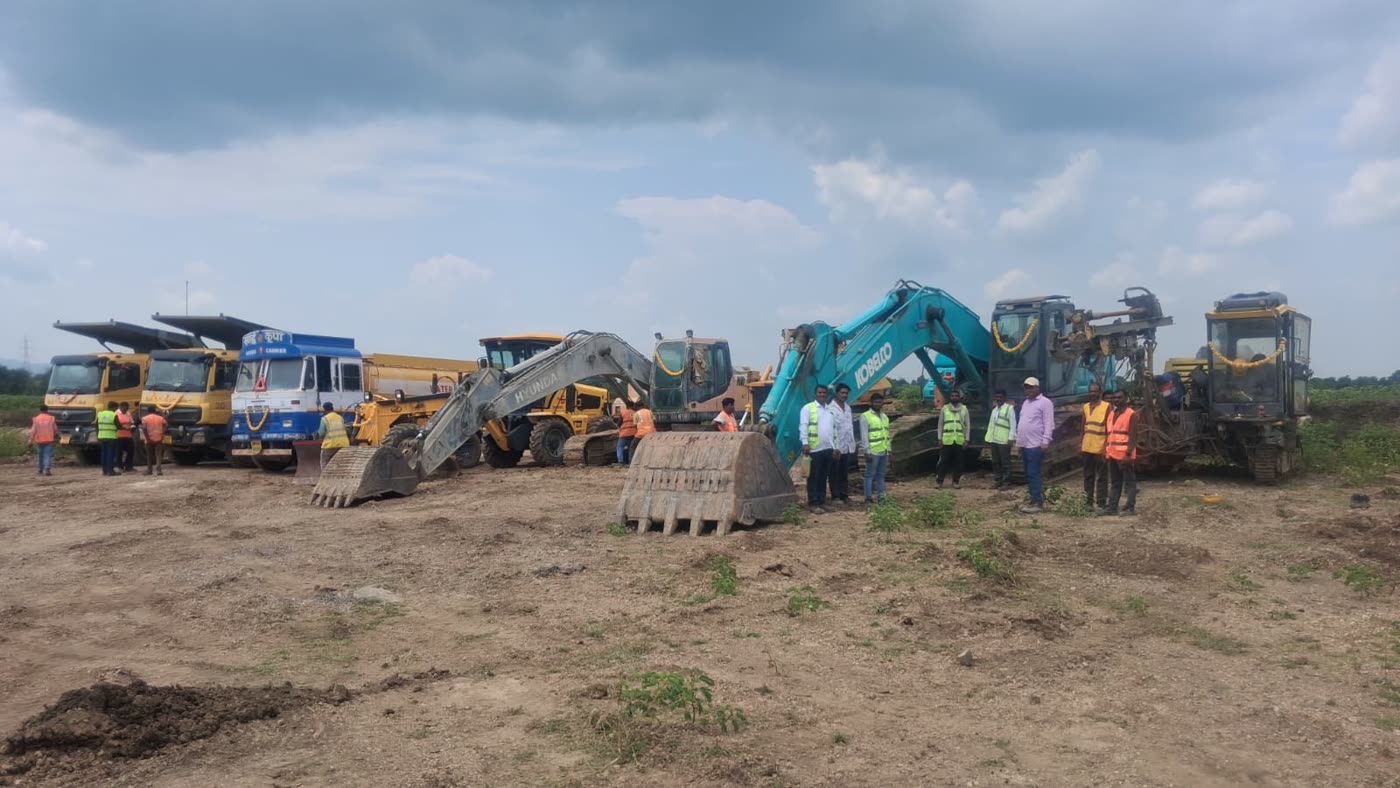Company tipper fleet, excavators and site crew assembled at a mine site
