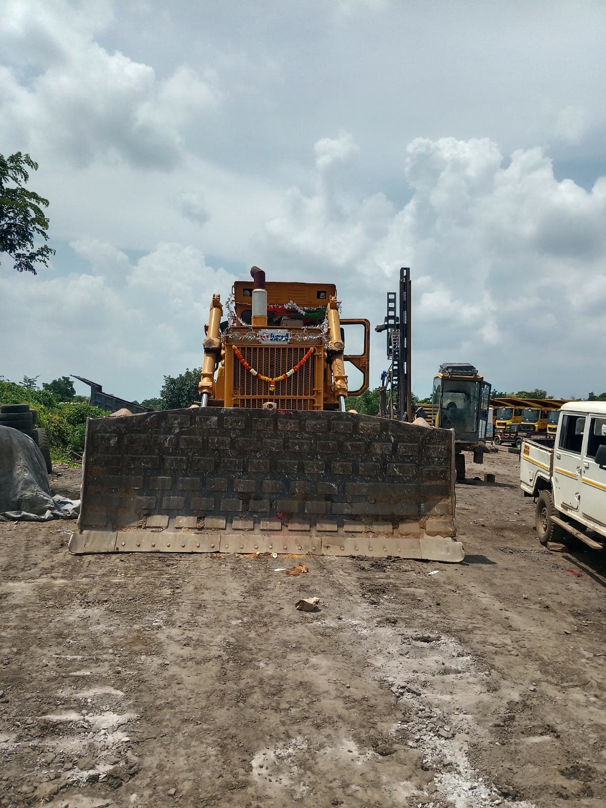 Bulldozer levelling material on a mining bench